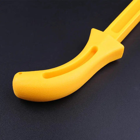 Close-up of yellow woodworking pusher safety push stick for carpentry, straight table push block for router table and saw projects, 280 by 32mm