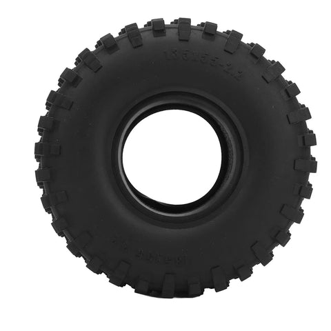 Knobby black off-road tire with deep tread, perfect for traction on rugged terrains.
