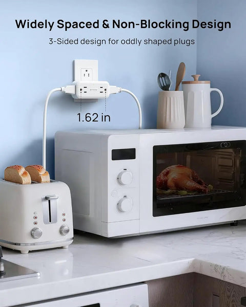Super Sleek 4 Outlet Surge Protector With 360 Rotating Head And Space Saving Design White Power Strip Extender in kitchen use.