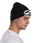 Premium Black And White Piano Plate Grid Knit Beanie Super Soft Winter Hat For Men And Women on a model, side view, showcasing design.