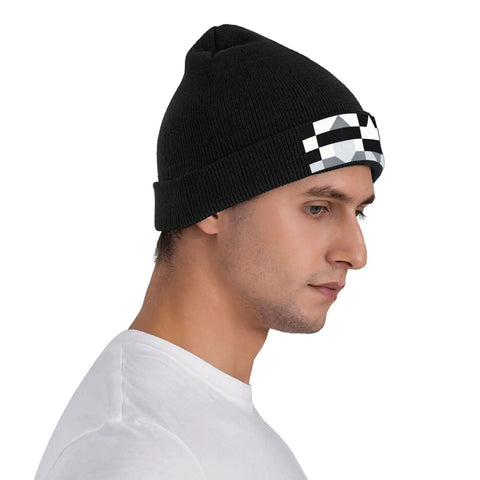 Premium Black And White Piano Plate Grid Knit Beanie Super Soft Winter Hat For Men And Women on a model, side view, showcasing design.