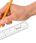 Hand holding Crystal Clear Acrylic Ruler 6 Inch Beveled Edge With Easy To Read Markings See Through Straight Edge for drawing.