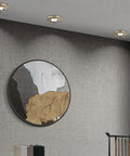 Nine Pack Slick Recessed Lighting Trim Kits With Dimmable LED Downlights For No Sweat Hotel Or Home Installations Top Shelf Bronze Finish illuminating a textured gray wall.