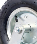 Four Pack Of Black Pneumatic Caster Wheels Combining 12 Inch Ribbed Tires And Precision Ball Bearings assembly detail with steel hub.