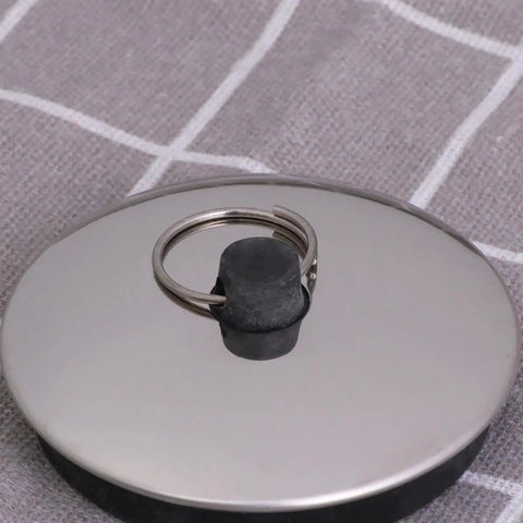 Close-up of 2pcs Rubber Bathtub Drain Stopper for Kitchen and Laundry Use, featuring a flat rubber design with a metal pull ring.