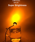 50 Pcs Three Quarter Inch Amber LED Marker Lights Kit illuminating a glass of water, showcasing super brightness features.