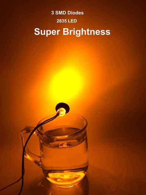 50 Pcs Three Quarter Inch Amber LED Marker Lights Kit illuminating a glass of water, showcasing super brightness features.