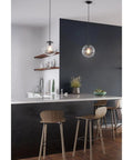 One Light Clear Glass Globe Pendant Light In Matte Black Modern Pendant Fixture With Clean Lines For Kitchen Island Dining Nook Foyer Or Living Room Great For Contemporary And Mid Century Decor hanging over kitchen island.