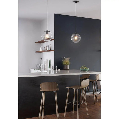 One Light Clear Glass Globe Pendant Light In Matte Black Modern Pendant Fixture With Clean Lines For Kitchen Island Dining Nook Foyer Or Living Room Great For Contemporary And Mid Century Decor hanging over kitchen island.