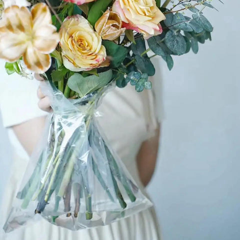 Clear Flower Water Bags Pro Grade 100 Pack Transparent Wrapping Sleeves For Bouquets displaying fresh bouquet stems in use.
