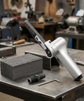 Top Shelf Pneumatic Air Belt Sander With A Ridiculously Fast 10 Mm Track And Hog Wild 16000 Rpm Motor on a workbench with metal blocks.