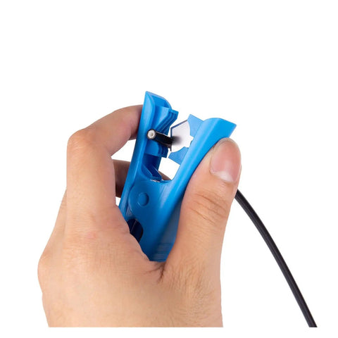 Hand using Pro Bike Hydraulic Disc Brake Tool Kit With Pneumatic Grippers to cut brake hose, aluminum alloy.