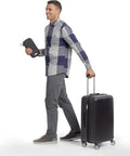Man holding RFID Blocking Passport Wallet For Travel And On The Go Organization With Durable 100 Percent Nylon Build