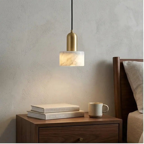 HLRCB Indoor Pendant Light, Marble Adjustable Drop, Modern Suspended Mount over a bedside table with books and a mug.