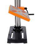 Compact 10 Inch Benchtop Drill Press With Enclosed Class I Laser Positioning System, Digital Meter Display, Variable Speed Control And Tilting Table. Close-up of tilt table with orange surface.