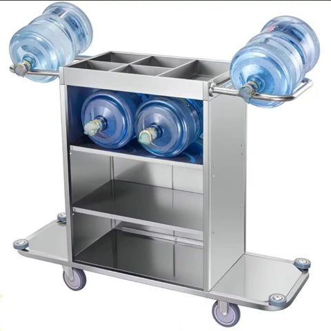 Straight Up Heavy Duty Three Tier Cleaning Cart With Two Roomy Cabinets And Smooth Rolling Wheels For Hotel Housekeeping Hustle Sturdy Painted Iron Frame Top Shelf Lid And Nifty Side Pocket Storage In Brown with water bottles on top.