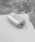 Close-up of single 5 Pack Quiet DC Toy Motors 6V-9V High Speed 14000 RPM Replacement Part FF-050SK-11170 with metal casing.