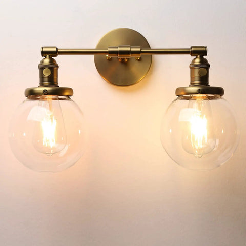 Industrial Style Double Wall Sconce Light, hardwired, with 5.9 inch round clear glass shades and dope brushed finish, illuminated view