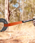 Beefy Forged Steel Winch Hook For Five Sixteenth Inch Cable, Six Ton Capacity in use with orange strap outdoors