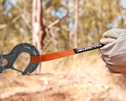 Beefy Forged Steel Winch Hook For Five Sixteenth Inch Cable, Six Ton Capacity in use with orange strap outdoors