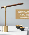Slim Banker LED Desk Lamp in wood and brass with adjustable arm on white tabletop