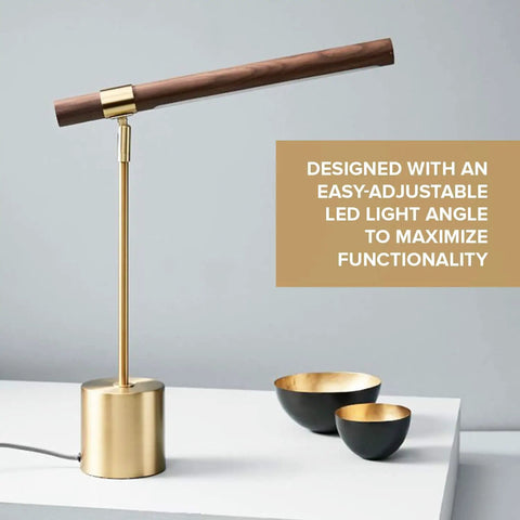 Slim Banker LED Desk Lamp in wood and brass with adjustable arm on white tabletop