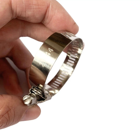 Stainless steel clamp for 35mm 1-3/8 Inch Black High Temperature 4-Ply Reinforced Silicone Hose Cap in a hand, side view.