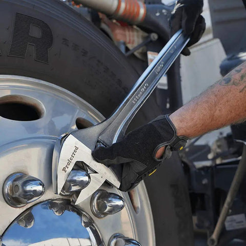 Mechanic using 24 Inch Adjustable Wrench With Raised Head And Chrome Finish, Wide Grip Jaw For A Broad Range Of Fasteners on truck wheel