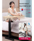 Adjustable Folding Laptop Table With Smooth Casters Total Game Changer For Couch Bed Or Office Setup, shown next to a woman on a bed.