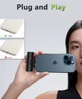 Woman holding Grab And Go Mini Portable Charger Packing Sleek Built In Usb C Cable Plug Right Into Device No Tangled Cords To Deal With Pocket Sized Power Bank.