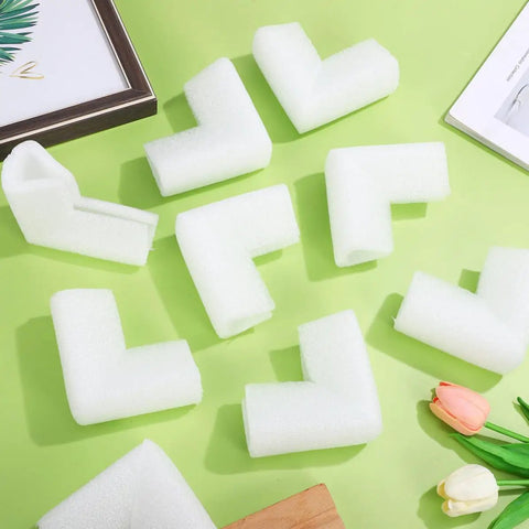 Thickened Foam Corner Protectors For Picture Frames And Mirrors, Adjustable L Shaped Cushions arranged on a green surface.