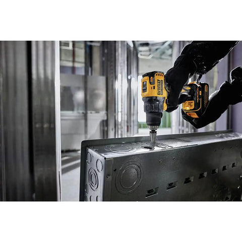 Person using Atomic 20V Max Cordless Drill Half Inch Chuck Tool Only Brushless Motor Variable Speed Trigger Compact Design in metalwork