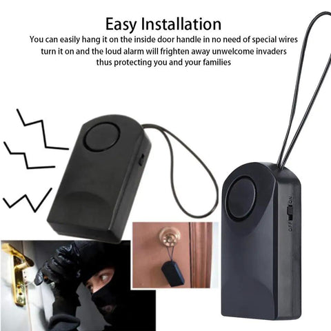 Ultra Loud 120dB Door Sensor Alarm For Home, Travel And Hotels, Touch, Vibration And Magnet Detection For Kids Safety, Luggage, Backpack, And Security, Instant Alerts When Door Opens, black portable unit hanging on door handle