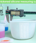 Ultimate Resin DIY Kit Silicone Measuring Cups Set with 600ml and 100ml Mixing Cups shown with caliper at 3mm thickness.