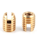 Close-up of self-tapping brass inserts from Beefed Up Batwing Fairing Brass Bolt Kit for Motorcycles 1996 2017