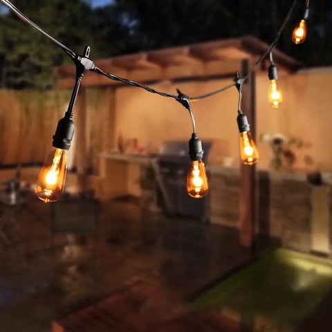 24 Pack Edison Style Replacement Bulbs For Outdoor String Lights 7W E17 ST40 Clear Glass Lamps Warm White 2300K on patio