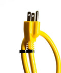 Close-up of yellow plug from Heavy Duty 8 Outlet Surge Protector Power Strip With 25 Foot Cord And Metal Mountable Design 1050 Joules Protection