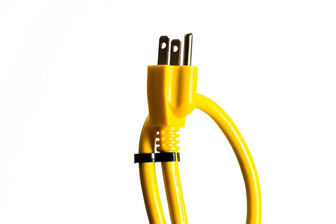 Close-up of yellow plug from Heavy Duty 8 Outlet Surge Protector Power Strip With 25 Foot Cord And Metal Mountable Design 1050 Joules Protection