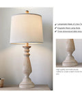 Mid Century 24.5 Inch Table Lamp Set of 2 with rustic beige resin base and linen shade on end table