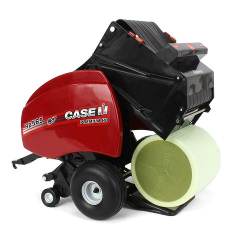 One Sixteenth Scale Case IH RB565 Round Baler Diecast Farm Toy With Two Round Bales, Working Bale Chamber displayed on white background