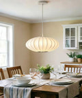 AFSEMOS 20" Japanese Wabi Sabi Pendant Light Silk Hanging Lantern Lamp above a dining table with elegant table setting.
