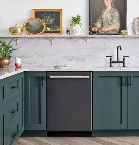Modern kitchen with 60 Pack 3 Inch Center To Center Matte Black Cabinet Pulls on green cabinets, white countertop, and artwork.