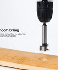 Drill using Sixteen Piece Dope Forstner Bit Set For Wood Drilling With Center Positioning on wooden board for flat hole