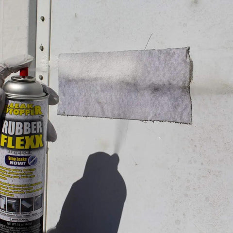 Waterproof Rubberized Sealant Spray For Fast Fixes That Seals Cracks Holes Leaks And Corrosion On Roofs And Other Surfaces With A Flexible Durable Weatherproof Rubber Coating In A 15 Ounce Bottle in use patching a wall