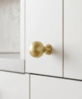 Top Shelf Brushed Gold Cabinet Knobs Six Pack For Modern Kitchen Drawers And Dressers Crafted From Solid Zinc Alloy Ridge Tough Construction Quick Install Mounting on white cabinet.