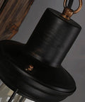 Close-up of Top Shelf Rustic Wall Sconce featuring solid wood backplate and vintage industrial metal lantern design.