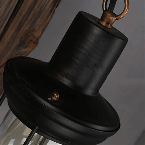 Close-up of Top Shelf Rustic Wall Sconce featuring solid wood backplate and vintage industrial metal lantern design.
