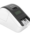 Ultra Fast Network Label Printer With Bluetooth And Ethernet Wireless Connectivity Slick Monochrome Printing Up To One Hundred Ten Labels Per Minute showing labels printing in an office.