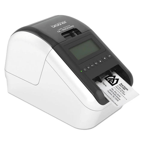Ultra Fast Network Label Printer With Bluetooth And Ethernet Wireless Connectivity Slick Monochrome Printing Up To One Hundred Ten Labels Per Minute showing labels printing in an office.