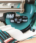 12 Inch 100 Tooth Carbide Tipped Miter Saw Blade for Max Efficiency in use cutting wood with gloved hand for safety